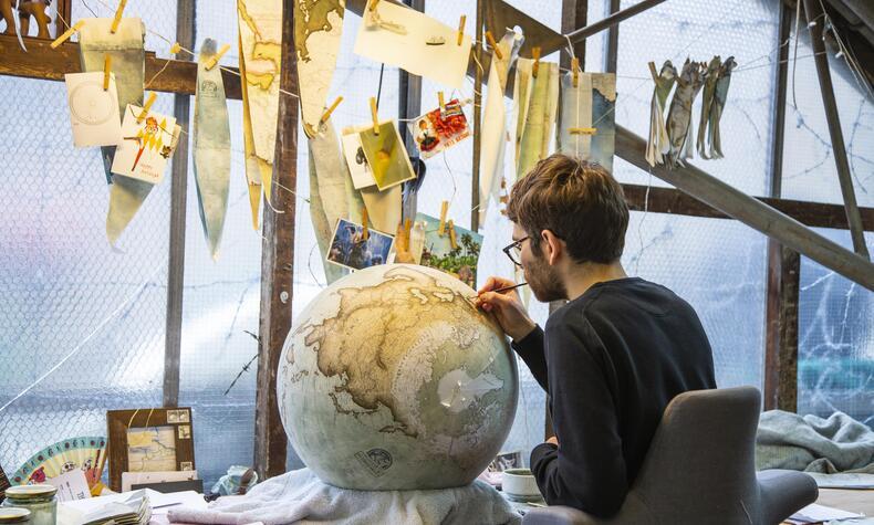 The studio has two cartographers who update and customize the paper maps that will later be used to line the globes. Photo: Paul Marc Mitchell. craftsmanship luxury bellerby globemakers london