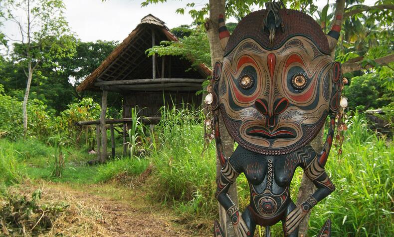 Large wood carvings are one of the most amazing and unique traditions in the country. papua new guinea remote travel