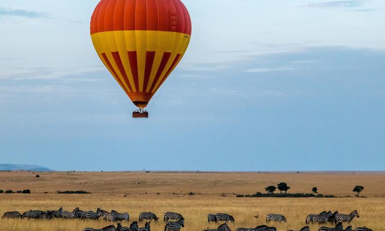 The experience of flying in a balloon over the zebra migration in Masai Mara, Kenya. Photo: Sutirta Budiman. maasai mara kenya luxury travel
