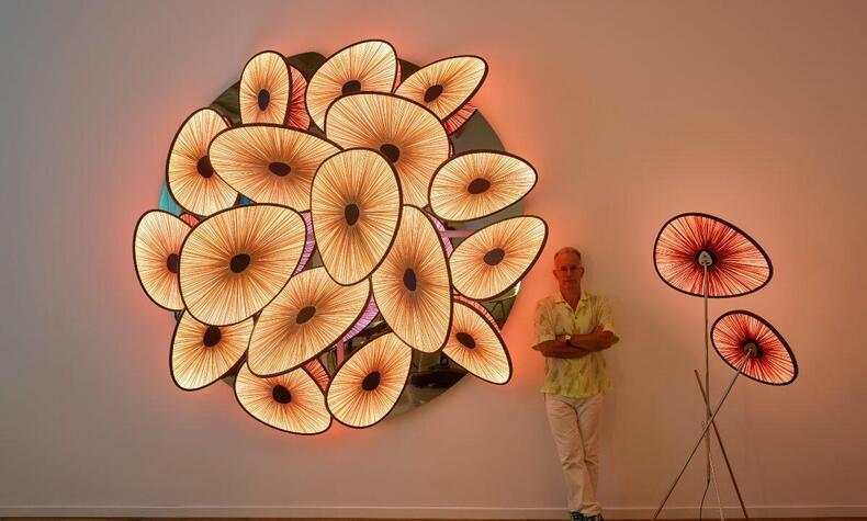 Albi Serfaty among the lamps of the Lakes collection presented at Design Miami