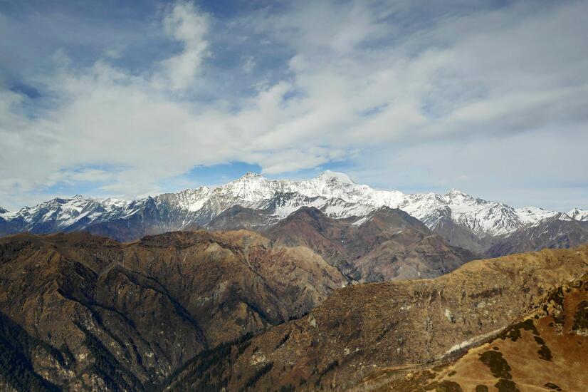 The Bhutan experience begins before the landing, flying over the Himalayan mountain range. luxury travel butan Himalayan mountain range Bhutan Happiness
