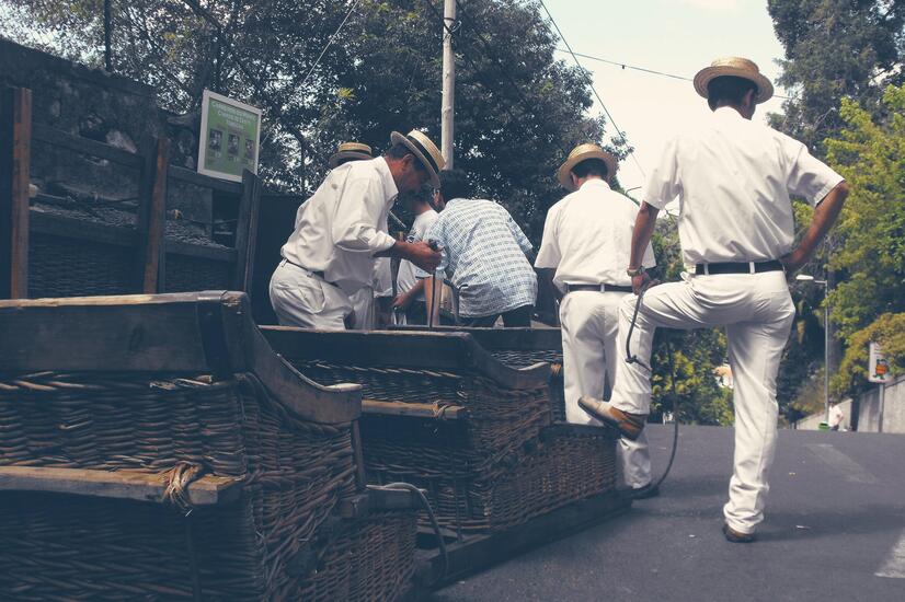 A unique experience in Madeira is the descent from the Santuario do Monte to the city of Funchal aboard a wooden basket. Photo: Ilaria. luxury travel madeira carreiros do monte