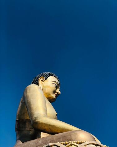 The statue is located in the middle of the ruins of Kuensel Phodrang. luxury travel butan buddha dordenma thimpu Bhutan Happiness