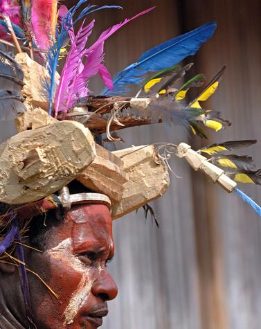 The men's adornments are very striking and most use feathers from different birds in their hats. papua new guinea remote travel