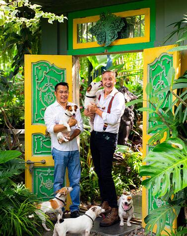 Bill Bensley with his partner Jirachai, designer and horticulturist, and some of his Jack Russells. bill bensley.