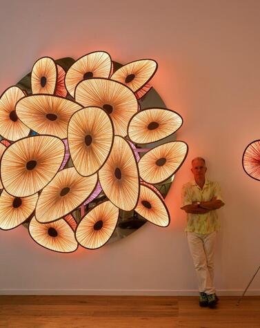 Albi Serfaty among the lamps of the Lakes collection presented at Design Miami