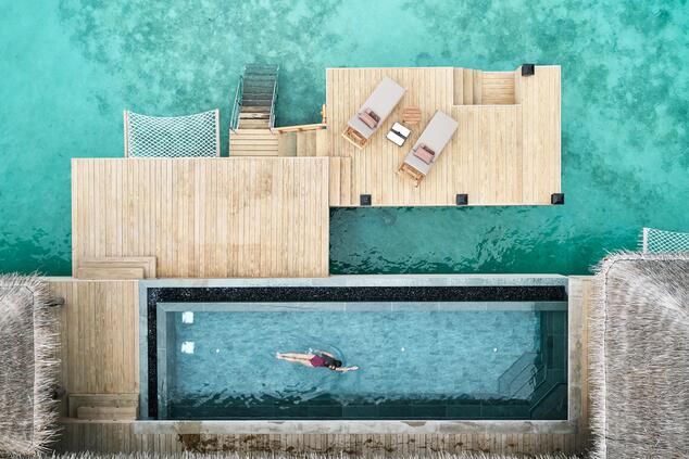 Sustainable luxury resort sustainable nature island beach Joali Maldives.