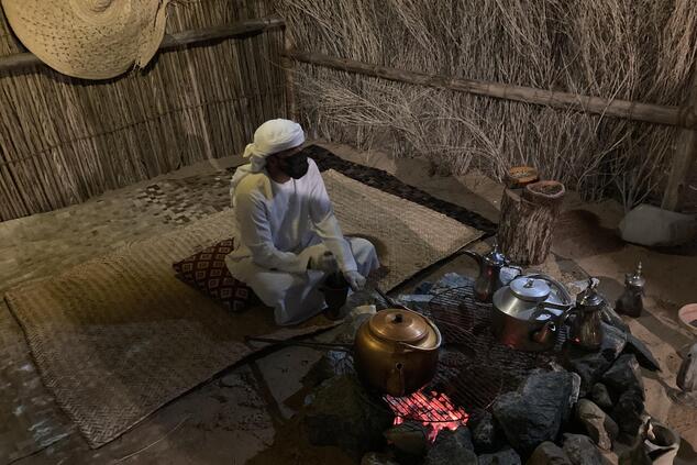 The coffee is made in the traditional way by boiling it with cardamom, which gives it a very special spicy touch. bedouin desert dining experience Dubai