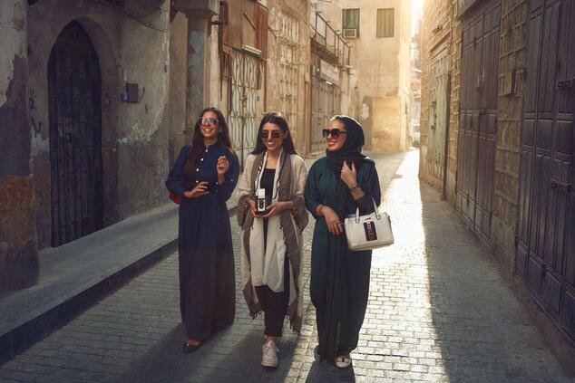Women strolling through the historic city center of Jeddah, a UNESCO World Heritage Site. jeddah luxury travel saudi arabia