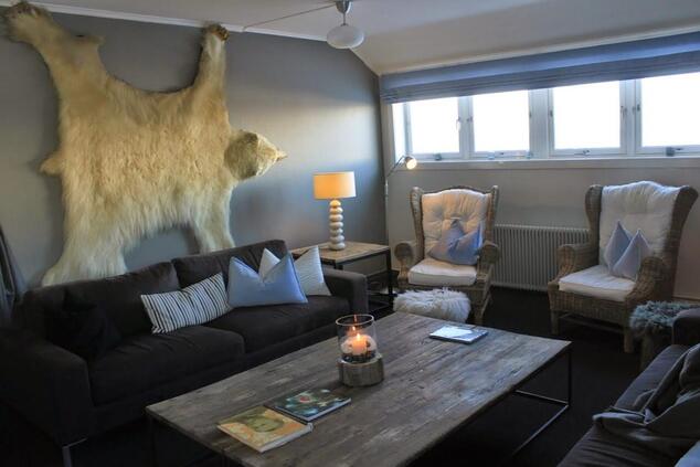 The hotel maintains a modern and cozy interior. isfjord radio svalbard.