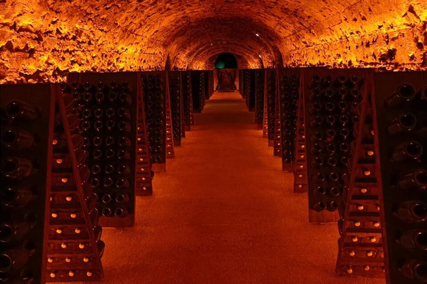 Interior of the cellar with the champagne bottles placed on the stirring tables invented by Madame Cliquot. veuve cliquot reims champagne winery