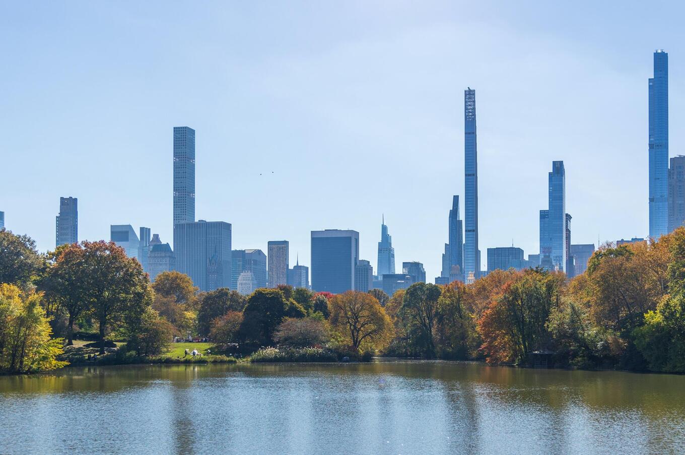 A breathtaking view of the New York skyline from the fall in Central Park. central park autumn new york