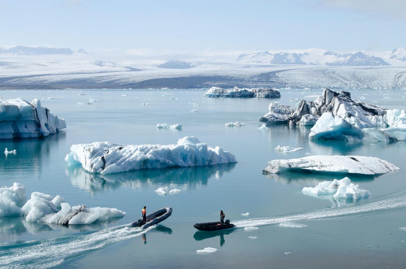 Boats in the Jökulsárlón lagoon. Photo by Rolf Gelpke on Unsplash.