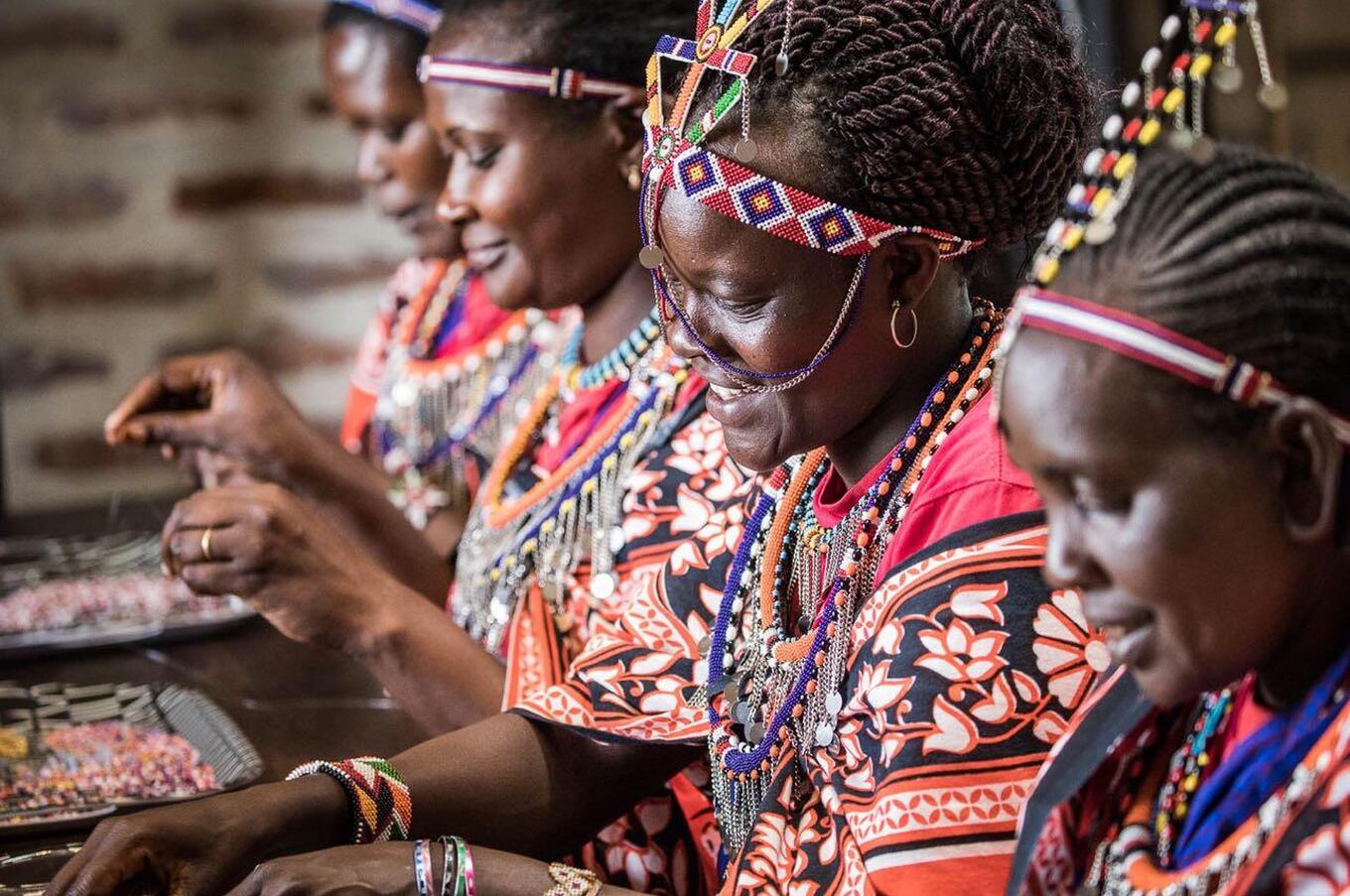 Samburu women preparing their traditional arrangements