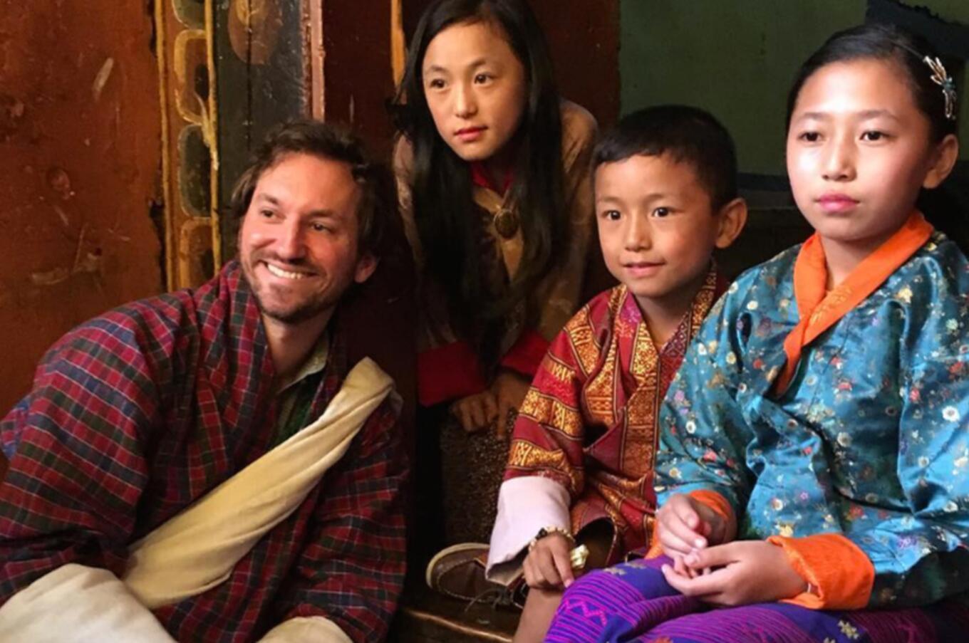 Matthew Desantis with a local family in Bhutan.