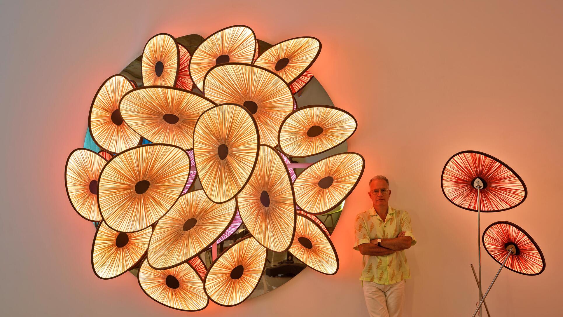 Albi Serfaty among the lamps of the Lakes collection presented at Design Miami