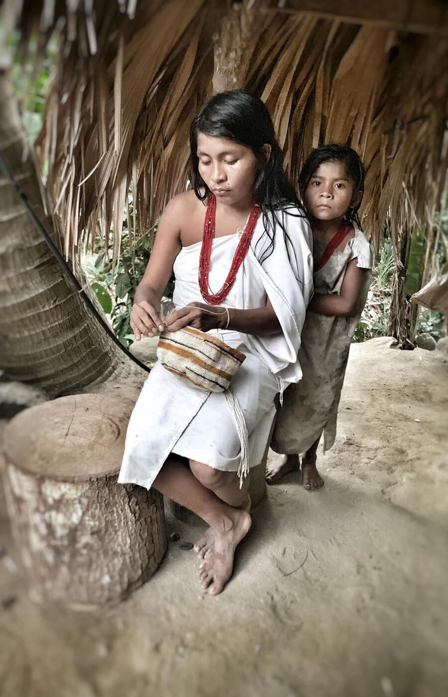 All members of the tribe are dressed in white. The women gather, card and spin wool and cotton, while the men weave the cloth. remote travel colombia ethnic groups the way of the kogui
